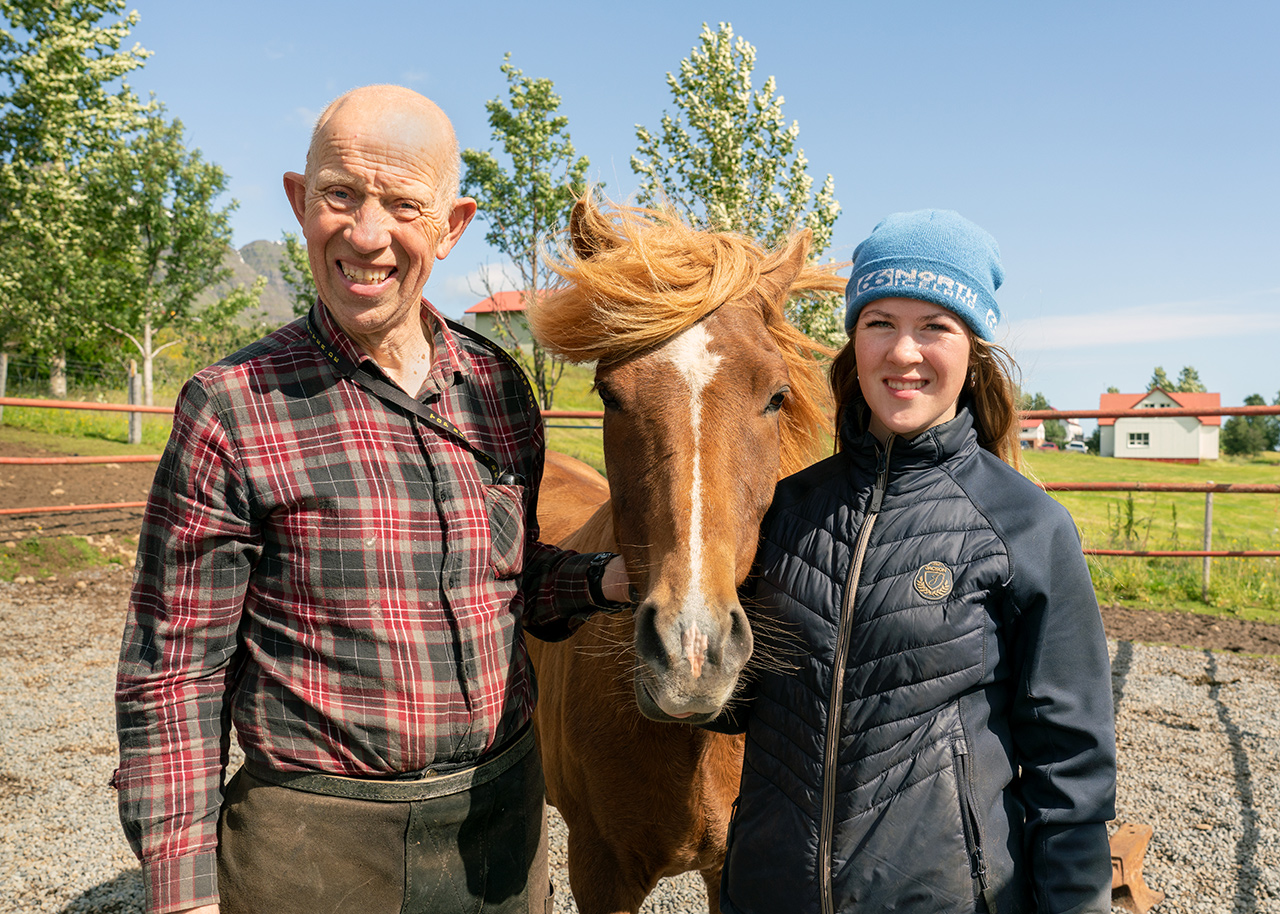 father and daughter with one of their horses at Skorrahestar, tour operator in Norðfjörður