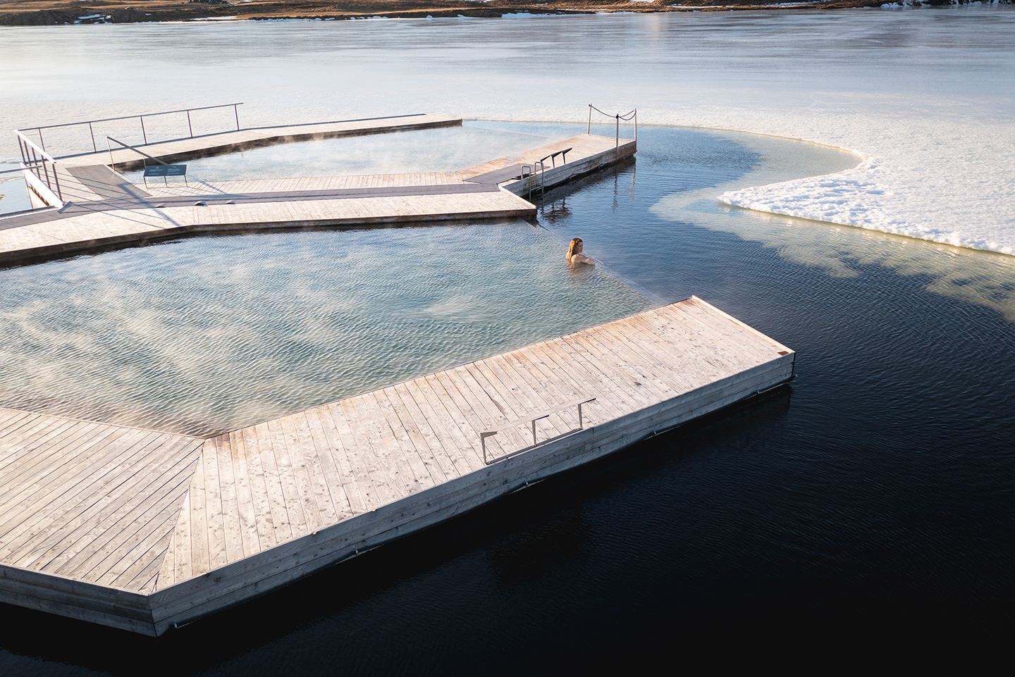 Woman enjoying a soak at Vök Baths