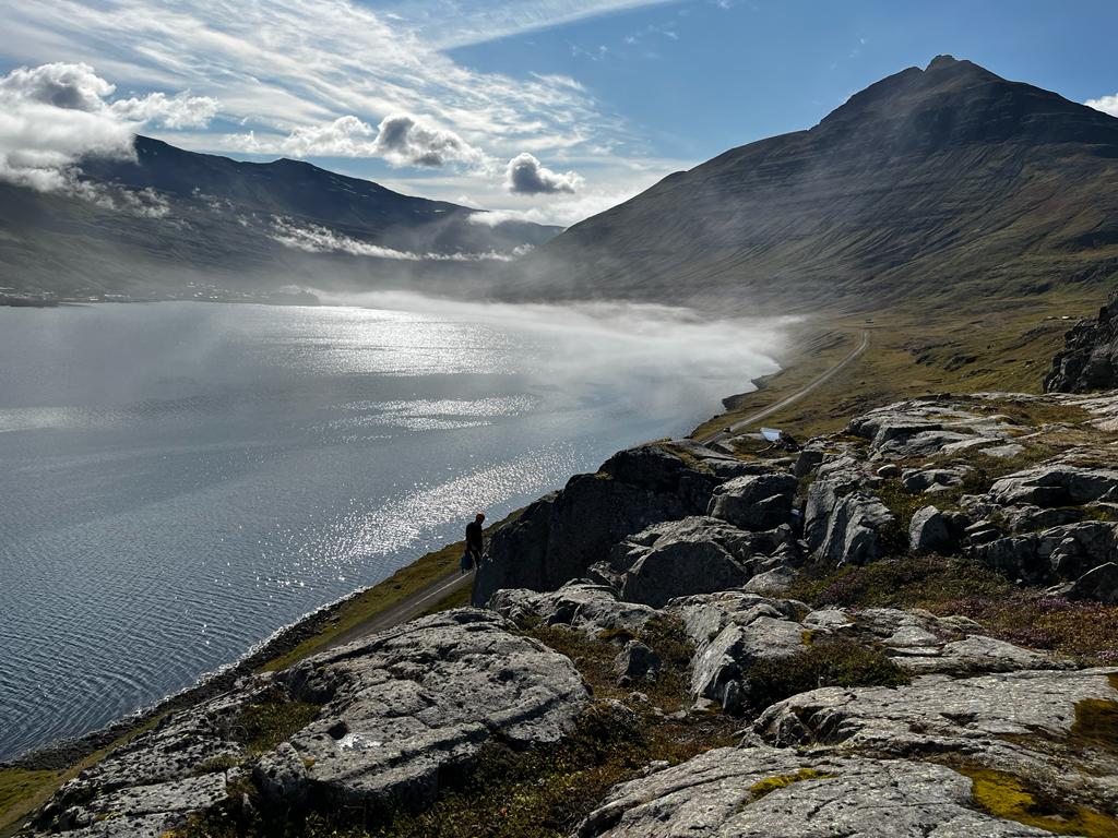 Climber on top of one of Many climbing routes in Seyðisfjörður